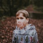 boy in gray and green sweater